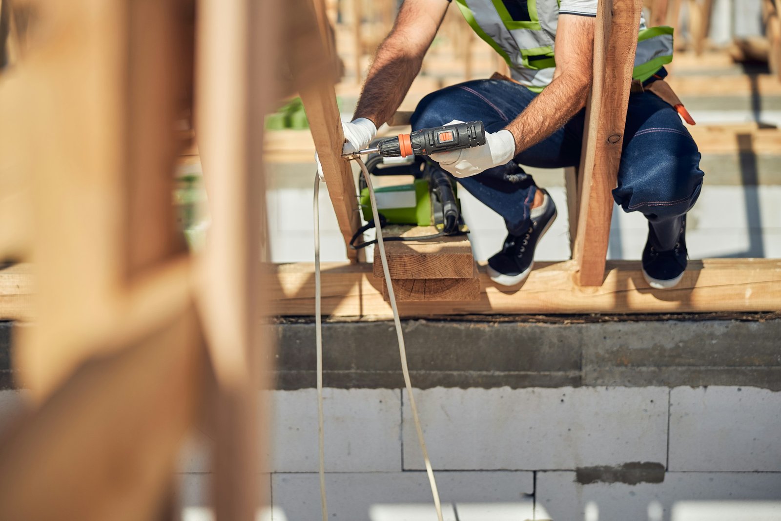 man working on the roof of a garage conversion